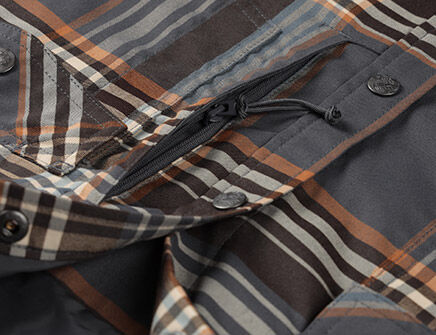 Concealed zip pocket with cord pull