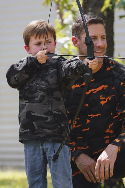Father and son wearing Legendary Whitetails clothing